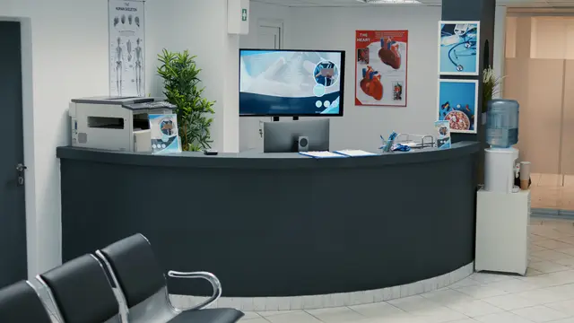 Clinic reception desk with waiting area