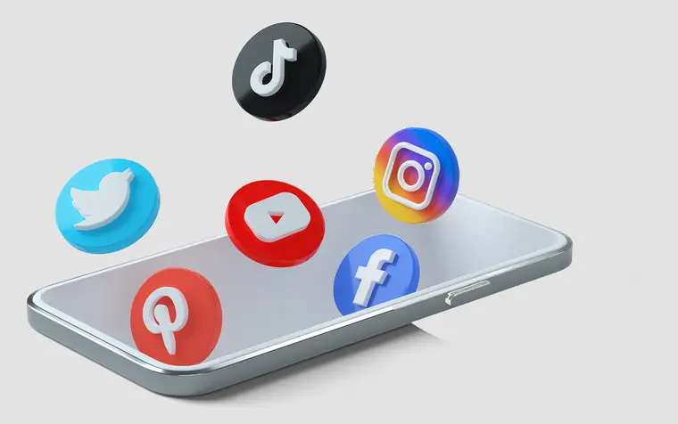 Social media icons floating above a smartphone